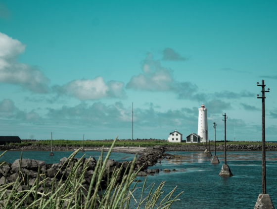 a light house sitting on top of a body of water